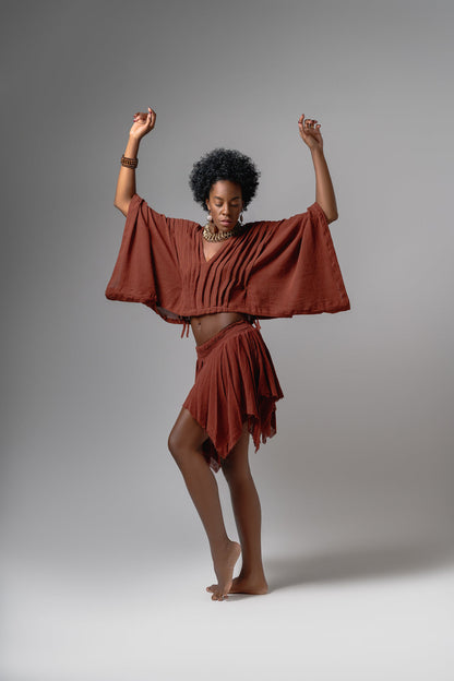 Top Alforzas terracotta cotton gauze top styled with matching skirt