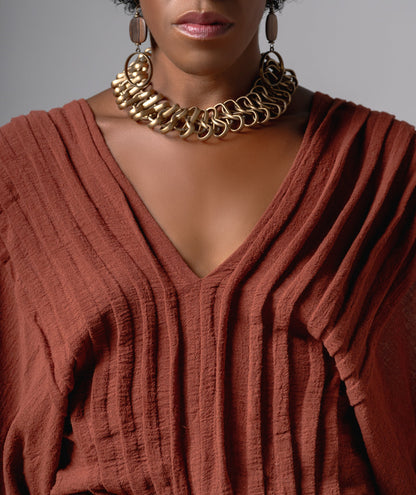 Top Alforzas pleated V-neck cotton gauze texture detail
